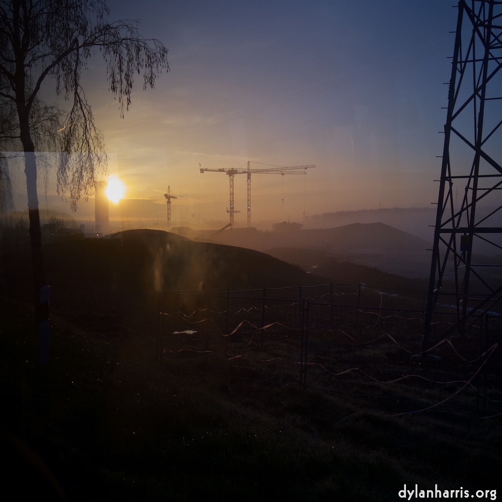 image: An early morning shot, into the sun, showing the building site that is to be the new National Stadium.